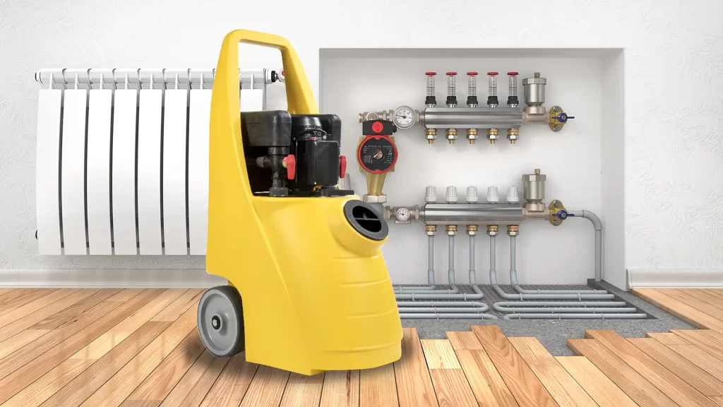 Pompa gialla per alta circolazione davanti a un impianto di riscaldamento. Pompa gialla per alta circolazione davanti a un impianto di riscaldamento.